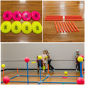 Yellow and Pink neon plastic discs and orange plactic pipes on a wooden background. School kids on teams throwing discs at balls propped on pipes of 9 Square in the Air Deluxe Game. 