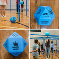 Blue, foam, multisided dice with different ways to play printed in black on each side. Students playing having fun playing 9 Square in the Air with one arm behind their backs. 