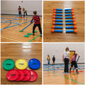 Colorful plastic discs and small blue pipe adapters with orange foam balls on the ends. Children enjoying competitive group play, using blue pipes to slide discs across a smooth floor. 